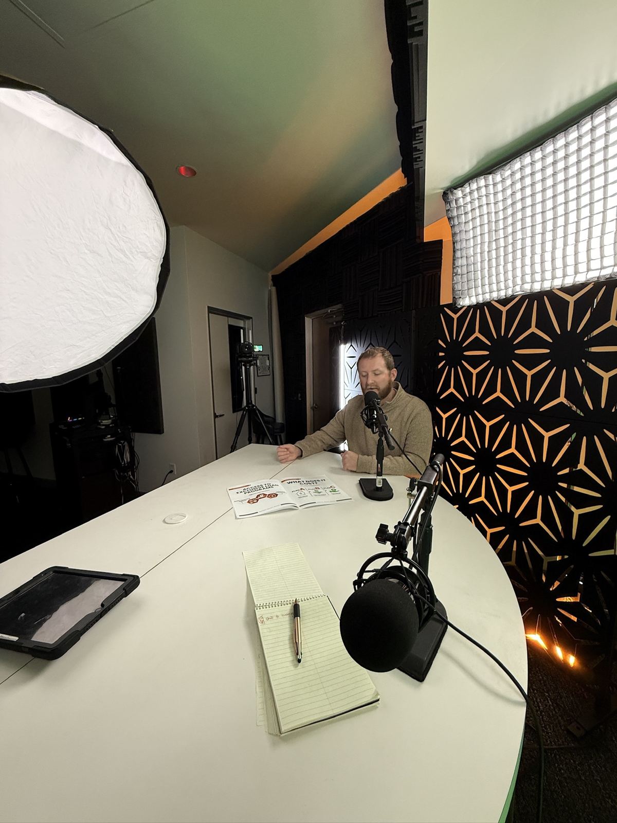 A podcast set with microphone and lighting